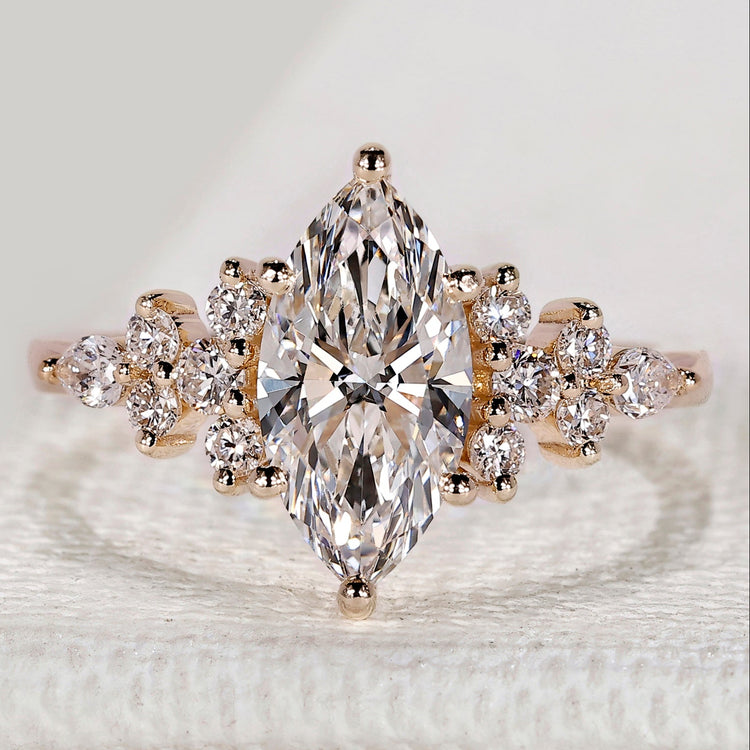 Marquise cut ring with round and pear side stones.
