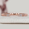 Open gap wedding band with marquise and round diamonds.