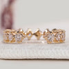 Open gap diamond wedding band with round diamonds.
