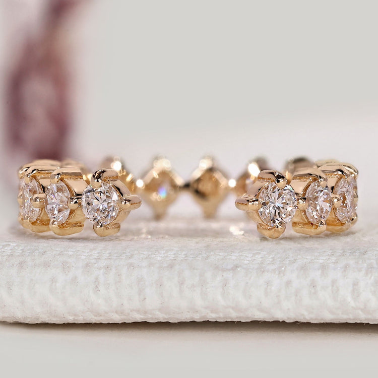 Open gap diamond wedding band with round diamonds.