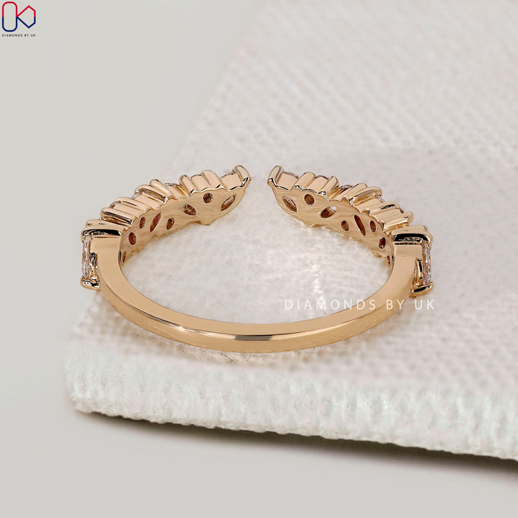 Marquise and round diamond band set in yellow gold with a low setting for daily wear.
