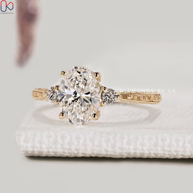 Oval three stone ring with tapered shank