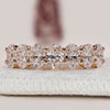 Oval cut diamond band with half eternity prong setting.
