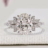 Oval cut engagement ring with marquise side stones.
