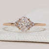 Oval cut engagement ring with seven stone design.