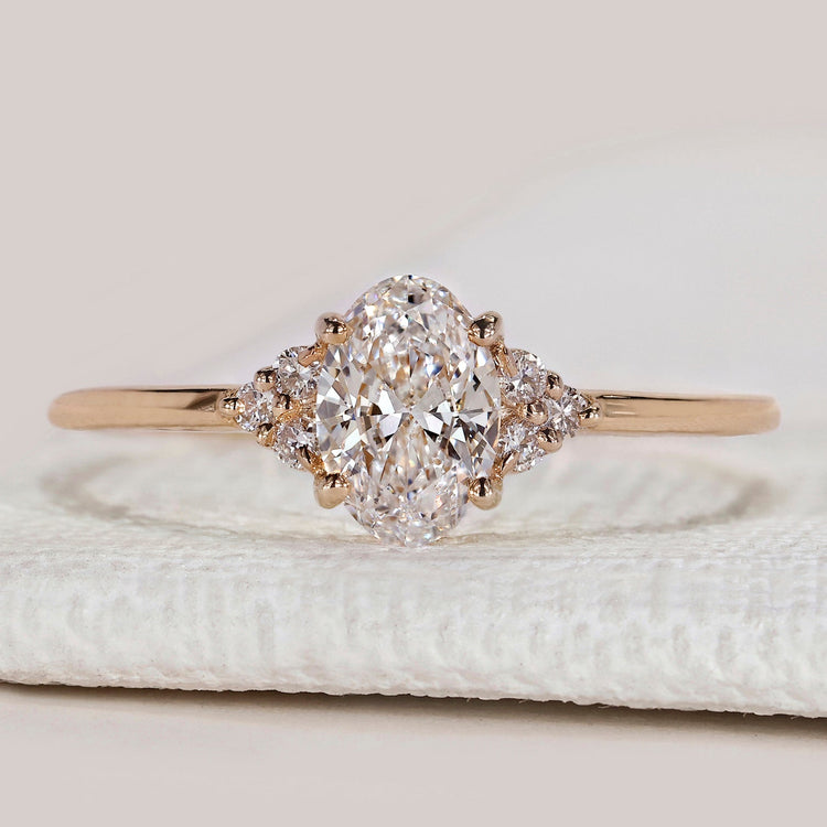Oval cut engagement ring with seven stone design.