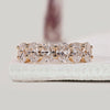 Oval diamond wedding band crafted in yellow gold for a refined half eternity look.

