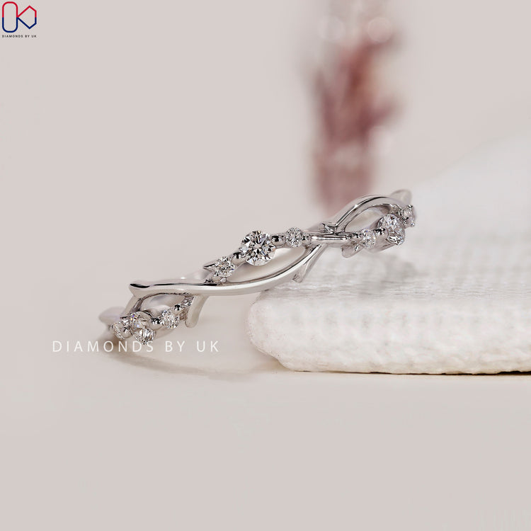 Leaf diamond band set in white gold with round cut lab grown stones.
