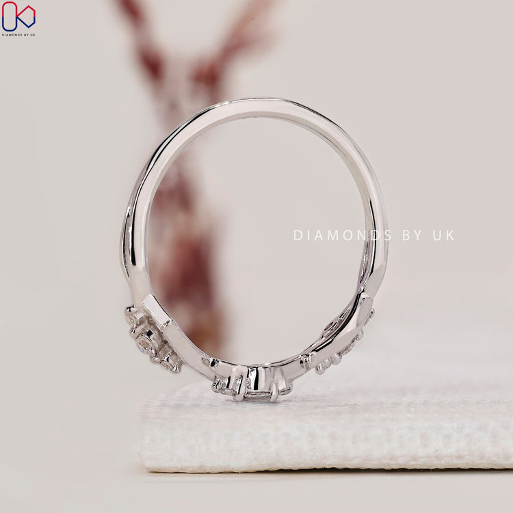 Handmade band with round cut lab grown diamonds and leaf accents.
