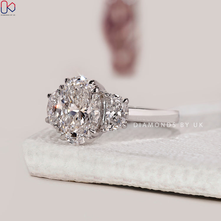 White gold diamond ring with lab grown oval stone.
