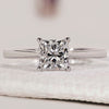 Princess cut engagement ring with solitaire engagement ring.
