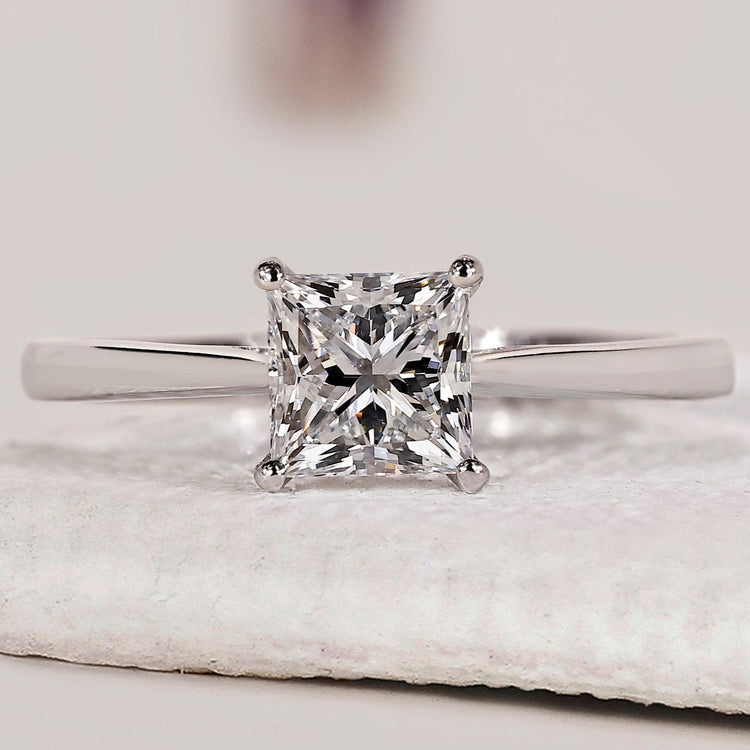 Princess cut engagement ring with solitaire engagement ring.

