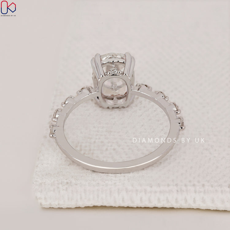 Handmade Jewellery featuring Cushion Cut Diamond Ring with prong setting, Distance Pave band, and white gold band.
