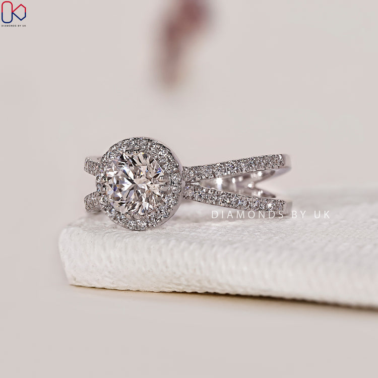 Exquisite handmade jewellery featuring a split shank ring with a halo diamond engagement ring.
