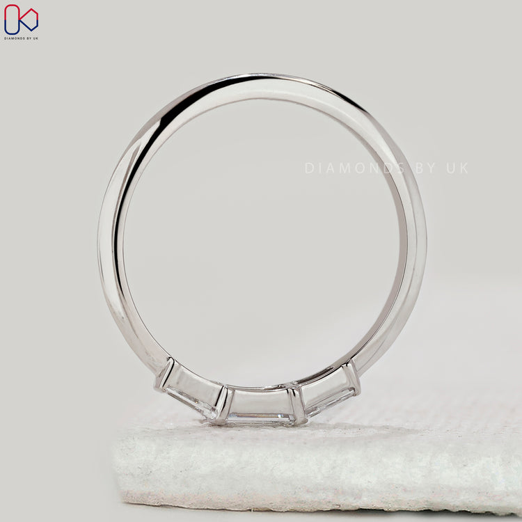 Handmade band with tapered baguette diamonds.
