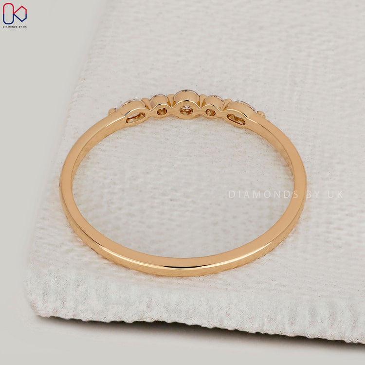 Diamondsbyuk wedding band in yellow gold.
