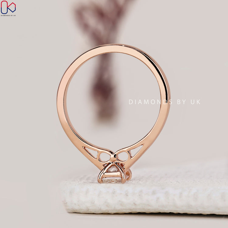 Infinity bridge diamond ring with princess cut center.