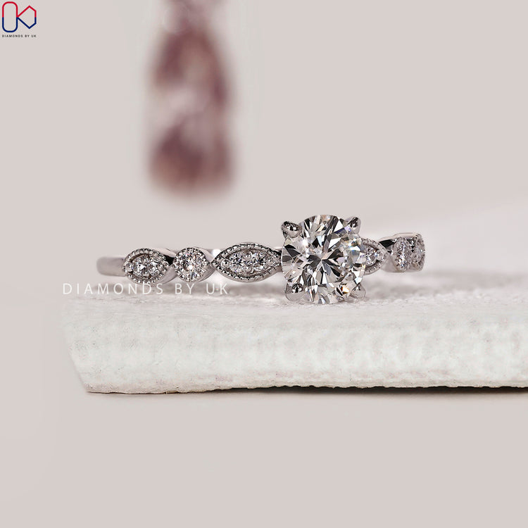 Handmade engagement ring with prong and milgrain setting.
