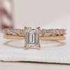 Emerald cut engagement ring with wedding band in a timeless design.
