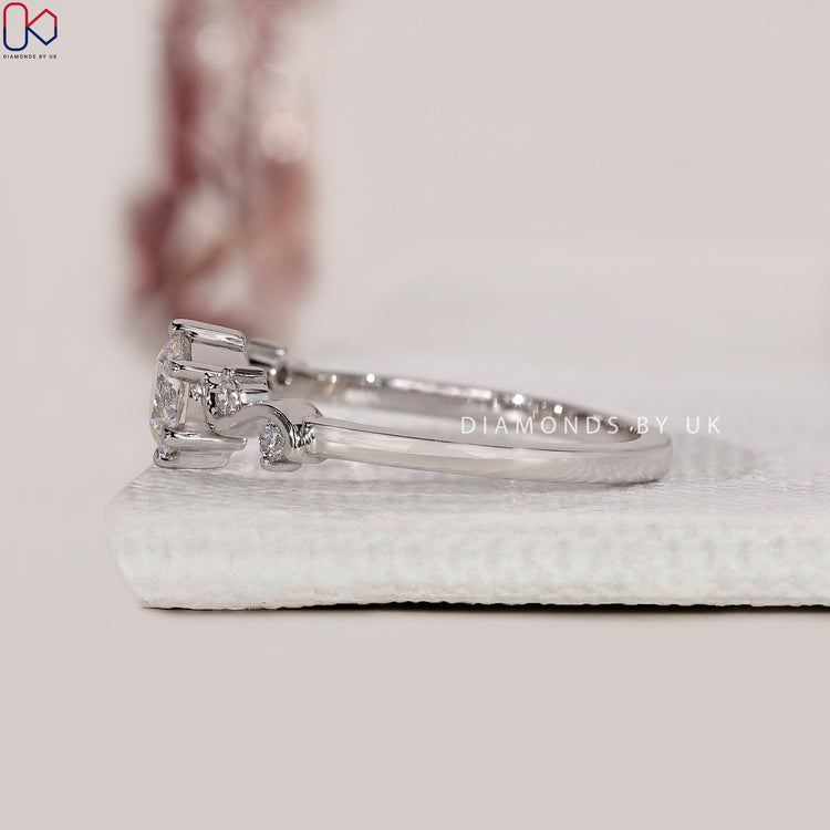 Engagement ring UK style combining historical detail with modern sustainable diamonds.
