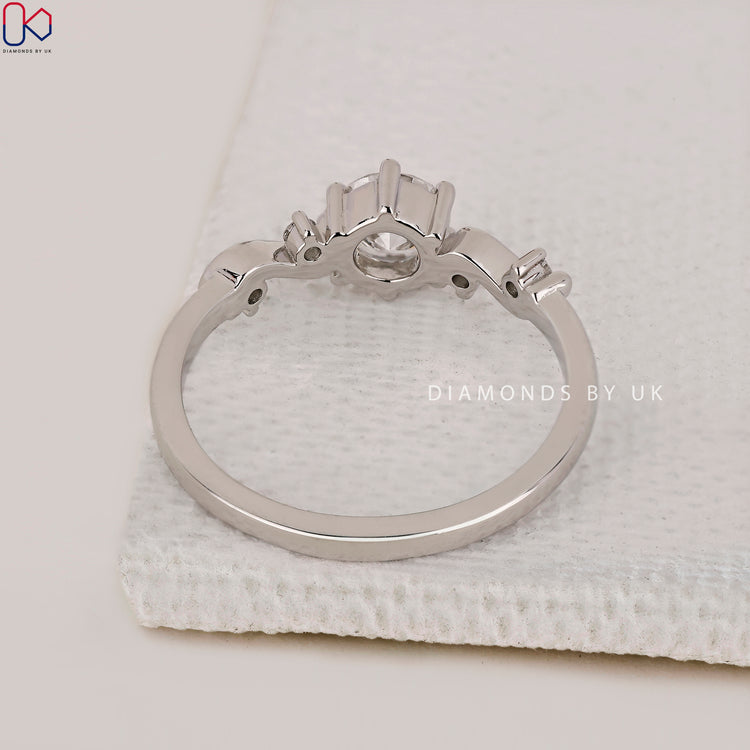 Filigree ring designed with intricate vintage styling and a round centre stone.