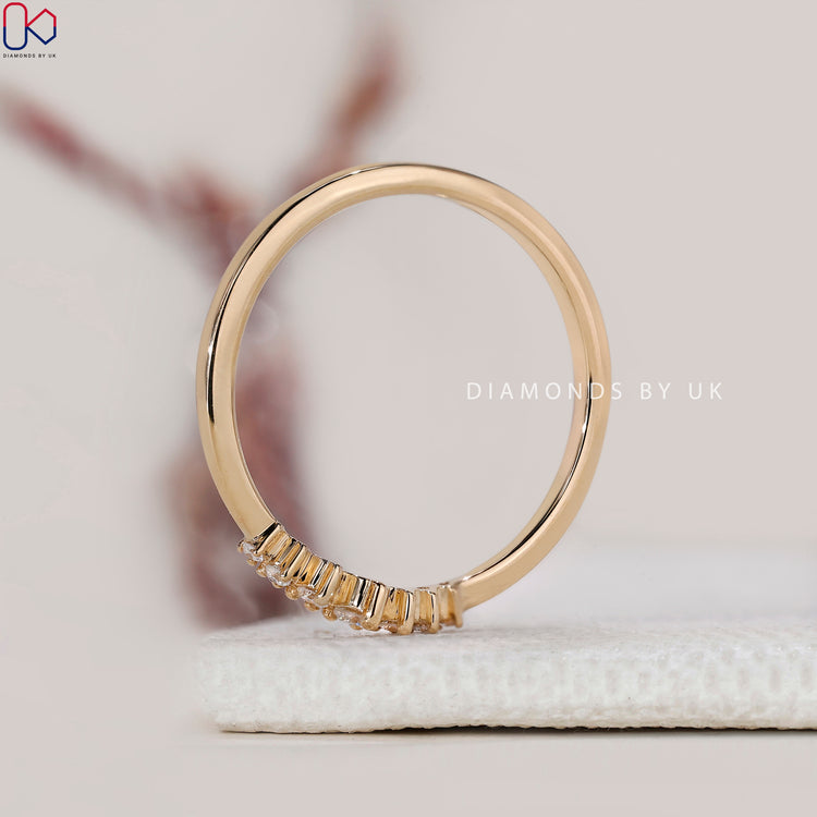 Handmade band featuring seven round cut lab grown diamonds.
