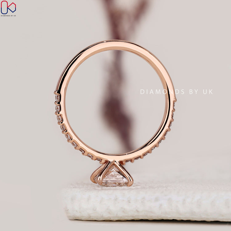 Handmade jewelry featuring princess cut engagement ring.