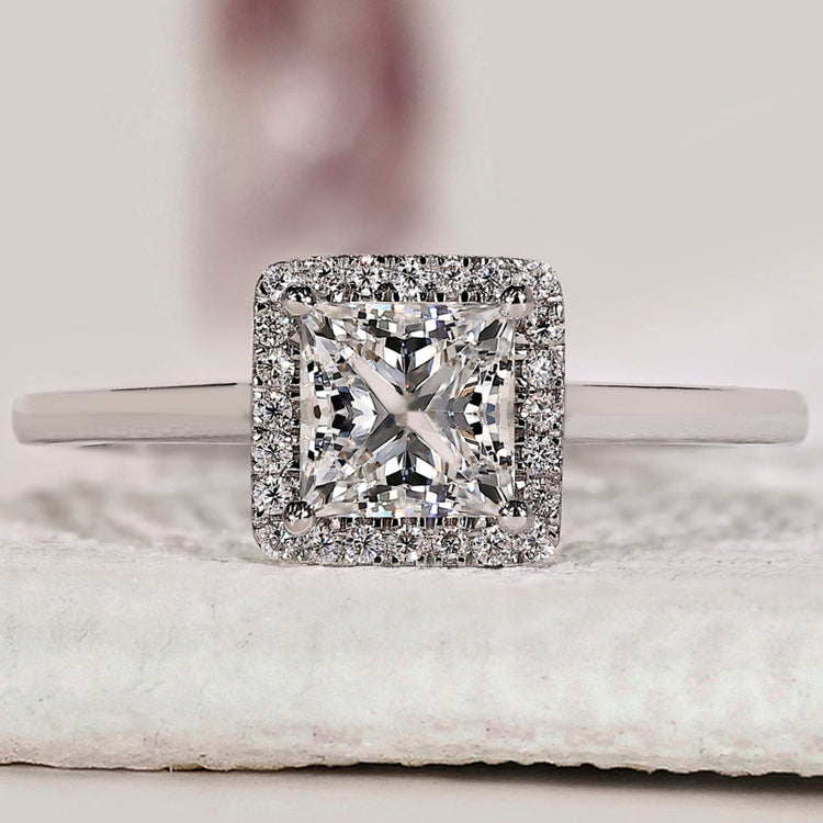 Princess Cut Diamond Ring with round cut halo setting.
