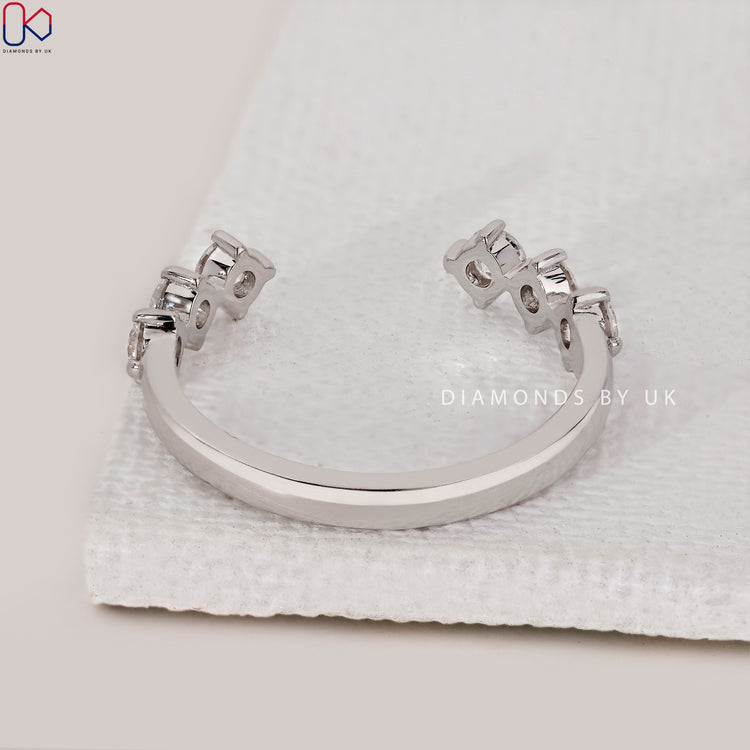 Handmade jewellery with round diamond wedding band.
