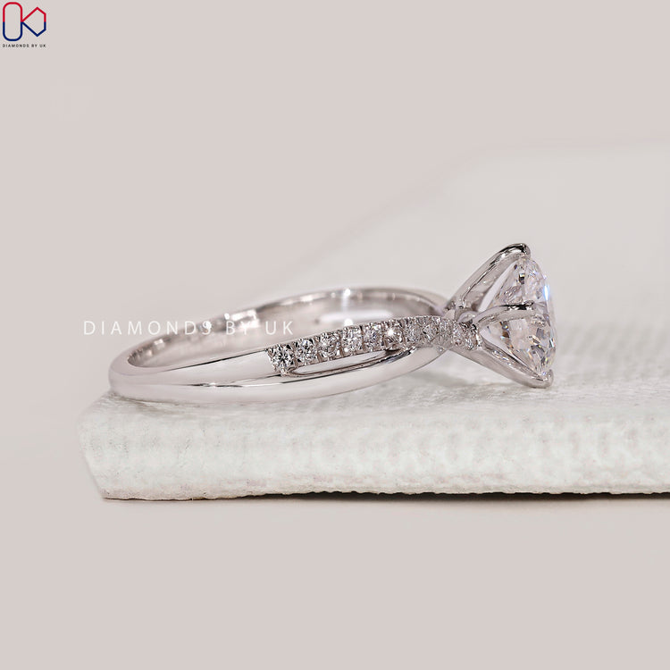 Twisted pave engagement ring in white gold.
