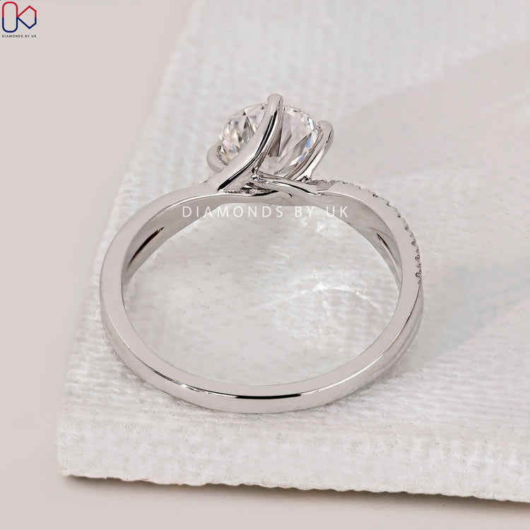 Buy engagement ring with 4 prong setting and pave details.
