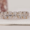 Oval cut diamond band crafted in yellow gold with prong setting.

