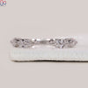 Handmade band with shared prong setting.
