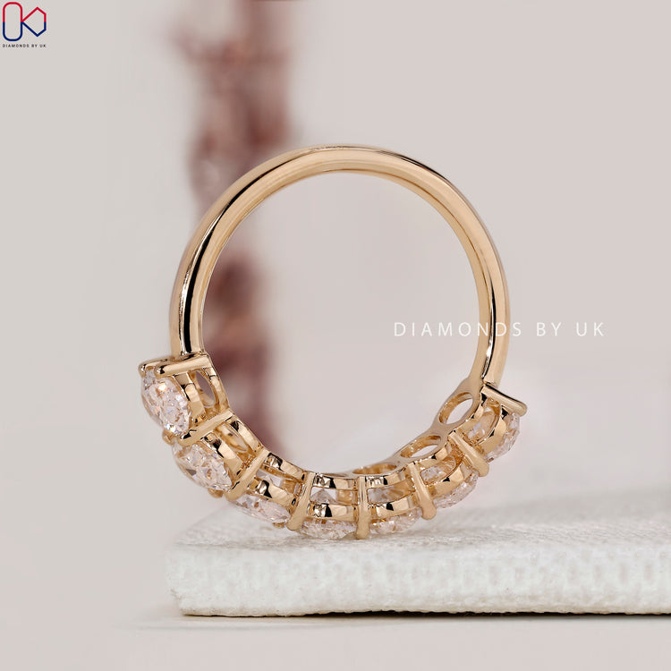 Handmade band with oval cut diamonds in a half eternity style.
