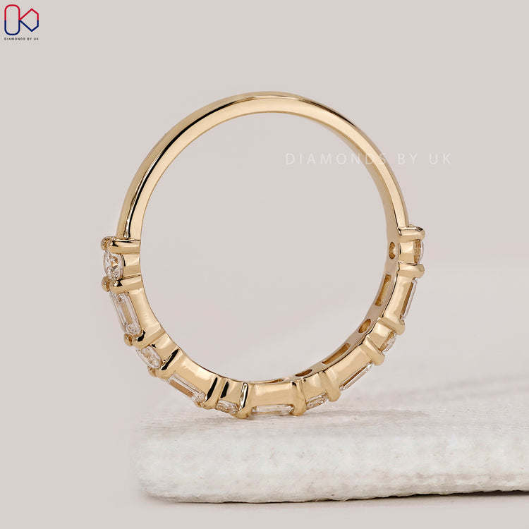 Diamondsbyuk wedding band in shared prong setting.
