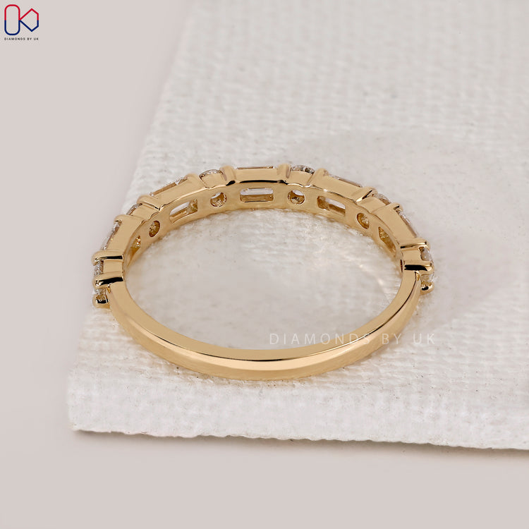 Custom handmade diamond band in yellow gold.
