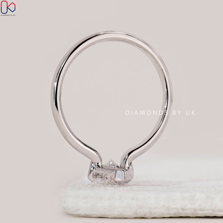 Buy diamond ring with marquise solitaire style.
