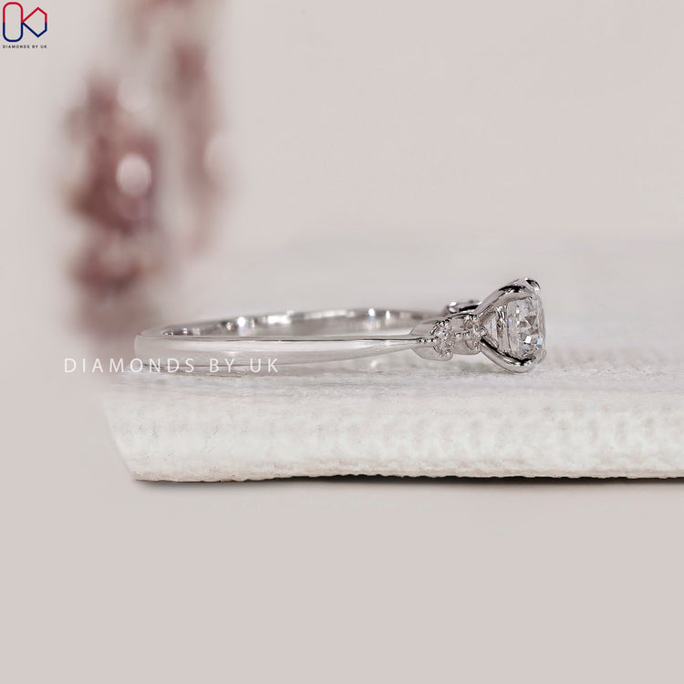 Tapered shank setting on a white gold engagement ring with five diamonds.
