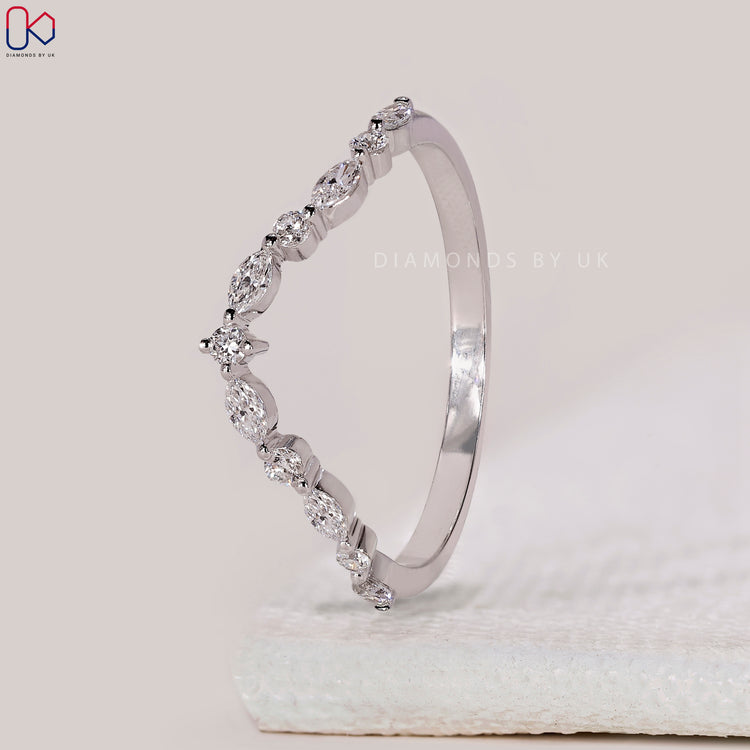 Yellow gold wedding band with chevron shape.
