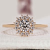 Halo diamond engagement ring in yellow gold.
