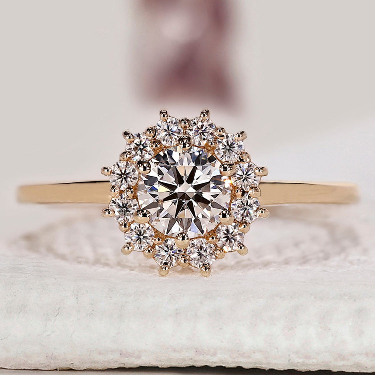 Halo diamond engagement ring in yellow gold.
