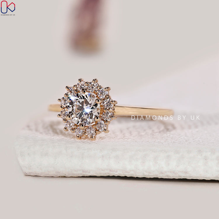 Handmade engagement ring with round cut diamond and halo.
