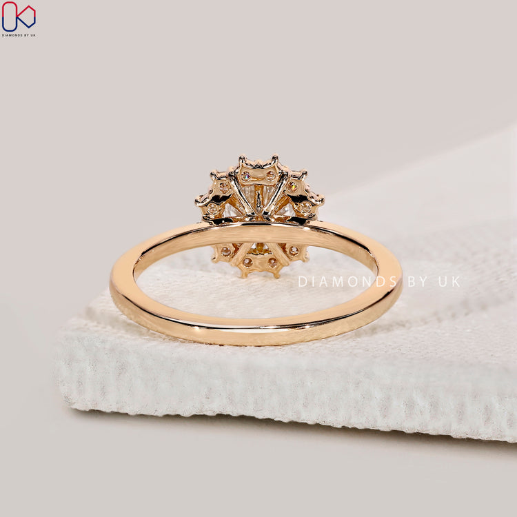 Handmade yellow gold ring with round halo setting.
