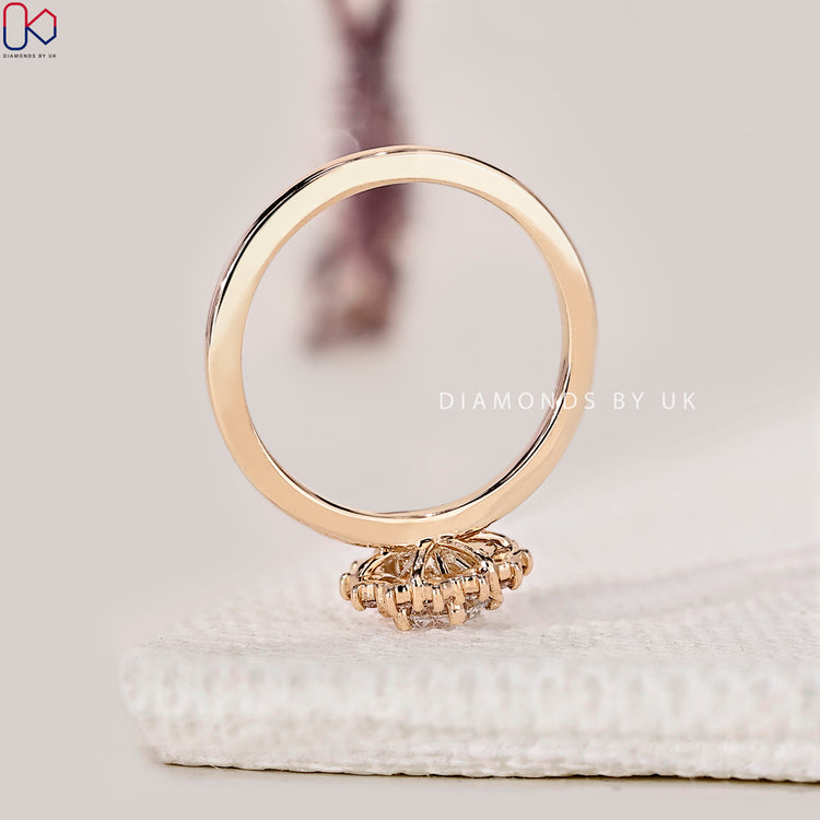 Halo engagement ring with round center diamond.
