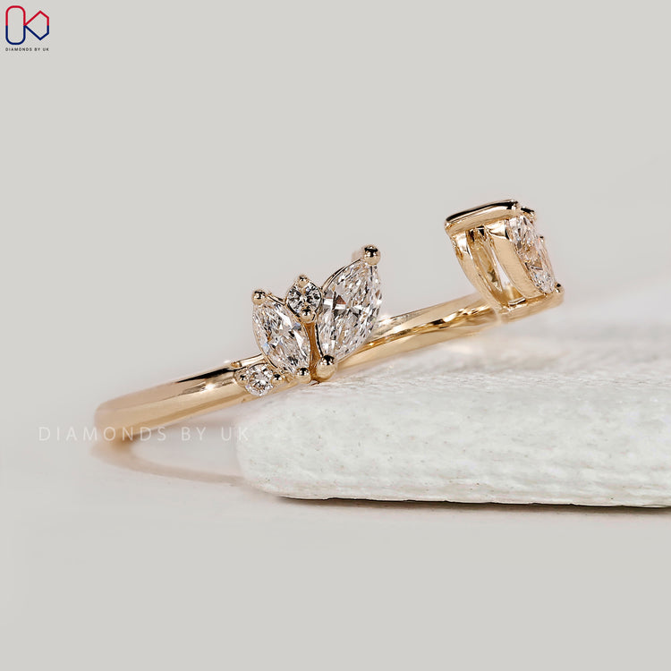 Custom diamond band with marquise and round stones.
