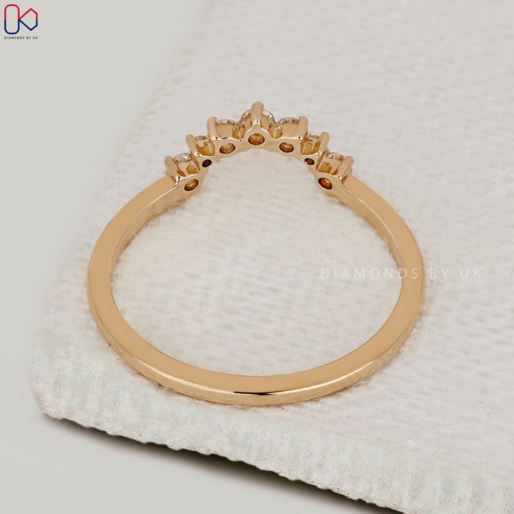 Handmade band with detailed diamond placement.
