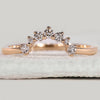Round diamond wedding band with a polished yellow gold finish.
