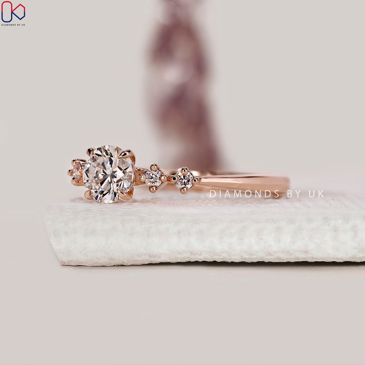 Handmade five stone engagement ring with round diamonds.
