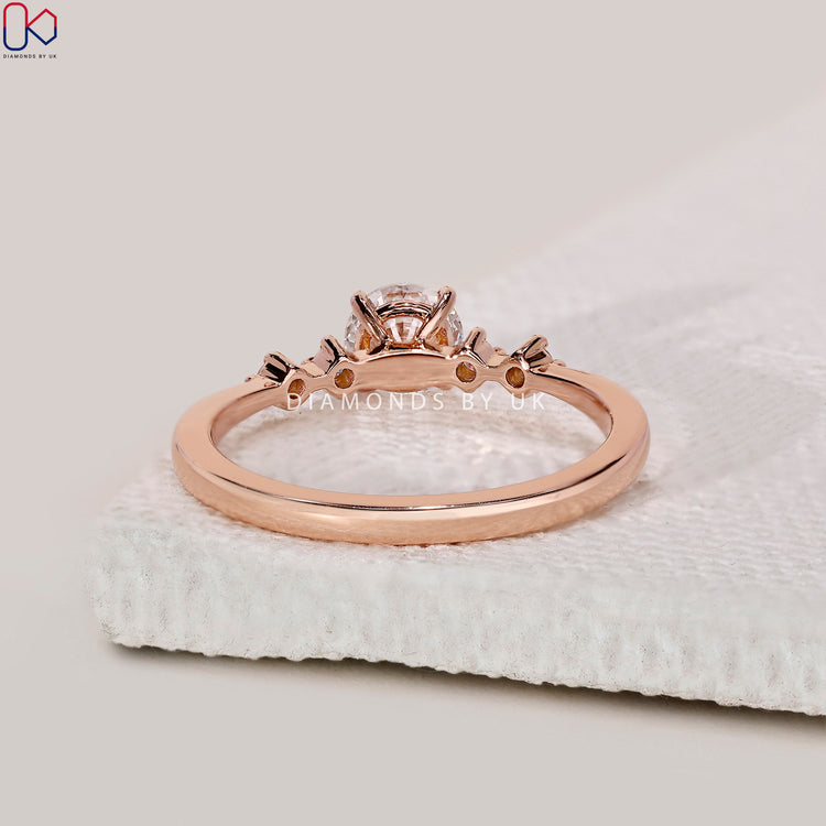 DiamondsbyUK five stone round cut diamond ring.
