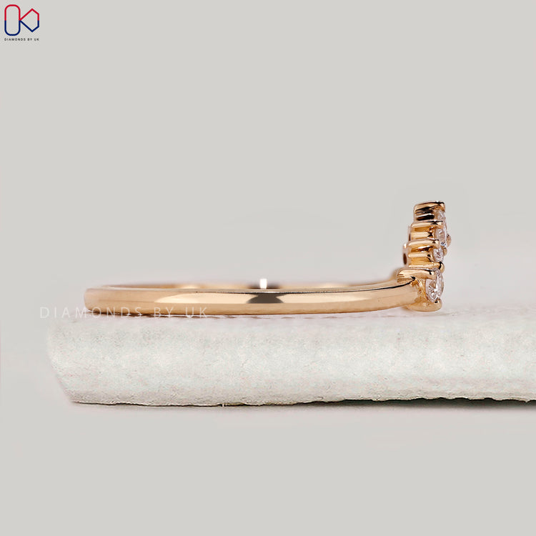 Stackable wedding band designed for layering with other rings.
